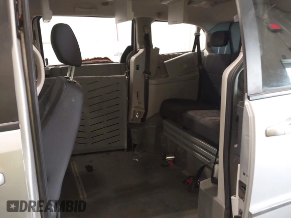 2010 Dodge Grand Caravan SXT with VIN 2D4RN5D15AR261319, listed as a IAAI auction lot 41877022 with 142,292 mi miles and . Bid and sale history available at DreamBid. Image 8.