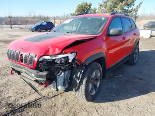 2019 Jeep Cherokee Trailhawk Elite with VIN 1C4PJMBX3KD217437, listed as a IAAI auction lot 41448614 with 85,889 mi miles. Bid and sale history available at carsss.com. Image 2.