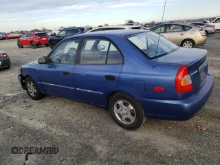 2000 Hyundai Accent z VIN KMHCG45GXYU125691, wystawiony jako Copart lot #87253294 z przebiegiem 91 062 mil mil oraz Szkoda całkowita • Salvage title. Historia ofert i sprzedaży dostępna na DreamBid. Obrazek 2.