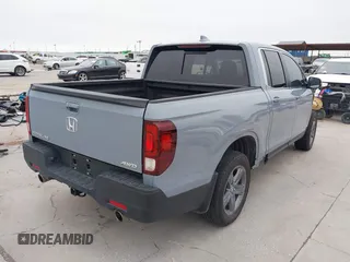 2023 Honda Ridgeline RTL with VIN 5FPYK3F58PB047099, listed as a IAAI auction lot 42313390 with Not provided miles and . Bid and sale history available at DreamBid. Image 4.