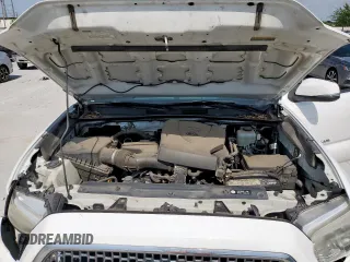 2017 Toyota Tacoma SR5 z VIN 5TFCZ5AN1HX048104, wystawiony jako Copart lot #60883165 z przebiegiem 143 856 mil mil oraz Szkoda całkowita • Salvage title. Historia ofert i sprzedaży dostępna na DreamBid. Obrazek 11.
