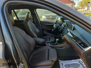 2017 BMW X1 xDrive28i with VIN WBXHT3C32H5F79305, listed as a Copart auction lot 54665865 with 113,046 mi miles and Clean Title. Bid and sale history available at carsss.com. Image 5.
