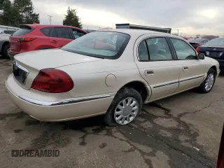 2001 Lincoln Continental with VIN 1LNHM97V11Y681989, listed as a Copart auction lot 46539725 with 107,130 mi miles and Salvage Title. Bid and sale history available at DreamBid. Image 3.