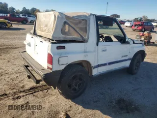 1990 Geo Tracker z VIN 2CNBJ18UXL6217744, wystawiony jako Copart lot #84203244 z przebiegiem 23 221 mil mil oraz Szkody całkowita. Historia ofert i sprzedaży dostępna na DreamBid. Obrazek 3.