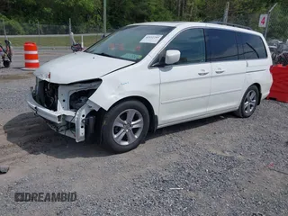 2010 Honda Odyssey Touring с VIN 5FNRL3H90AB039449, выставлен на аукционе IAAI как лот 42032203 с пробегом 128 265 миль миль и . История ставок и продаж доступна на DreamBid. Изображение 2.
