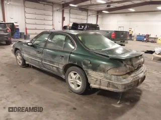 1997 Pontiac Bonneville SE z VIN 1G2HX52KXVH250272, wystawiony jako IAAI lot #41644041 z przebiegiem 160 791 mil mil oraz . Historia ofert i sprzedaży dostępna na DreamBid. Obrazek 3.
