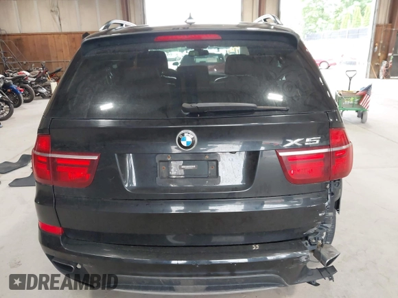 2012 BMW X5 50i with VIN 5UXZV8C50CL425721, listed as a IAAI auction lot 42590676 with 192,355 mi miles and . Bid and sale history available at DreamBid. Image 16.