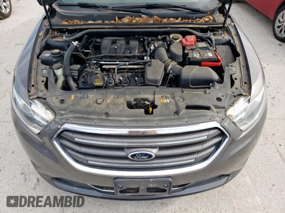 2013 Ford Taurus Limited z VIN 1FAHP2F89DG187913, wystawiony jako Copart lot #57096865 z przebiegiem 93 575 mil mil oraz Szkoda całkowita • Salvage title. Historia ofert i sprzedaży dostępna na DreamBid. Obrazek 11.