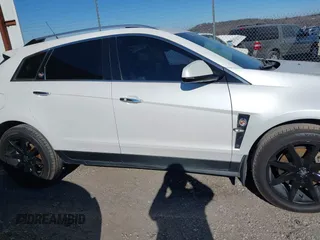 2011 Cadillac SRX Premium Collection with VIN 3GYFNCEY2BS624867, listed as a IAAI auction lot 41273945 with 209,296 mi miles. Bid and sale history available at carsss.com. Image 13.