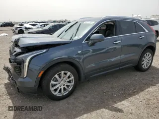2021 Cadillac XT4 FWD Luxury z VIN 1GYAZAR45MF000983, wystawiony jako Copart lot #49717955 z przebiegiem 59 911 mil mil oraz Szkoda całkowita • Salvage title. Historia ofert i sprzedaży dostępna na DreamBid. Obrazek 1.
