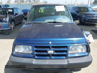 1997 Chevrolet Tracker z VIN 2CNBE1865V6926154, wystawiony jako IAAI lot #42207157 z przebiegiem 176 104 mil mil oraz . Historia ofert i sprzedaży dostępna na DreamBid. Obrazek 12.