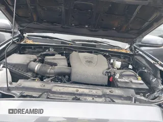 2023 Toyota Tacoma SR with VIN 3TYCZ5AN5PT138770, listed as a IAAI auction lot 41461423 with 19,785 mi miles and . Bid and sale history available at DreamBid. Image 10.