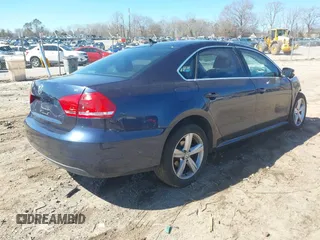 2013 Volkswagen Passat SE w/Sunroof & Nav with VIN 1VWBP7A35DC113692, listed as a IAAI auction lot 41720111 with 143,624 mi miles. Bid and sale history available at carsss.com. Image 4.