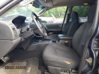2004 Jeep Grand Cherokee Laredo with VIN 1J4GX48S24C216941, listed as a Copart auction lot 55584785 with 279,710 mi miles and Salvage title. Bid and sale history available at DreamBid. Image 7.
