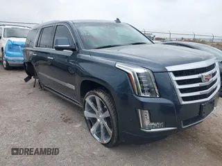 2019 Cadillac Escalade Premium Luxury z VIN 1GYS4CKJ4KR265131, wystawiony jako IAAI lot #41931554 z przebiegiem 94 367 mil mil oraz . Historia ofert i sprzedaży dostępna na DreamBid. Obrazek 1.
