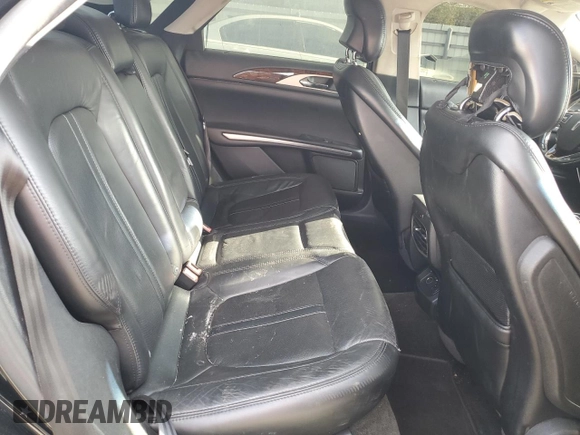 2016 Lincoln MKZ z VIN 3LN6L2G97GR614647, wystawiony jako Copart lot #55955655 z przebiegiem 142 655 mil mil oraz Szkoda całkowita • Salvage title. Historia ofert i sprzedaży dostępna na DreamBid. Obrazek 10.