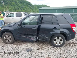 2012 Suzuki Grand Vitara Premium z VIN JS3TD0D6XC4100539, wystawiony jako IAAI lot #42384659 z przebiegiem 143 711 mil mil oraz . Historia ofert i sprzedaży dostępna na DreamBid. Obrazek 14.