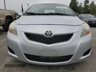 2009 Toyota Yaris z VIN JTDBT903691327542, wystawiony jako Copart lot #53231525 z przebiegiem 161 477 mil mil oraz Szkody całkowita. Historia ofert i sprzedaży dostępna na DreamBid. Obrazek 5.