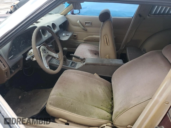 1981 Datsun 280ZX 2+2 z VIN JN1HZ06S3BX408927, wystawiony jako Copart lot #43963805 z przebiegiem 169 783 mil mil oraz Tytuł czysty. Historia ofert i sprzedaży dostępna na DreamBid. Obrazek 7.