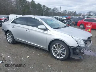 2015 Cadillac XTS Luxury z VIN 2G61M5S34F9125713, wystawiony jako IAAI lot #41257358 z przebiegiem 47 277 mil mil oraz . Historia ofert i sprzedaży dostępna na DreamBid. Obrazek 1.