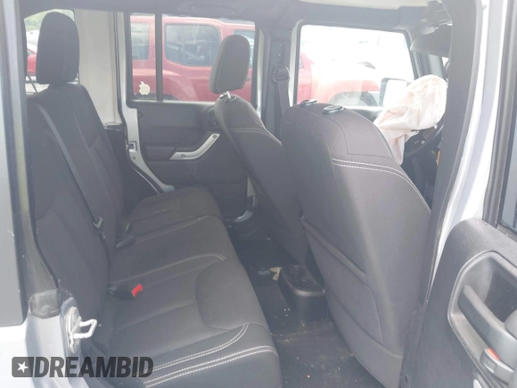 2014 Jeep Wrangler Unlimited Sahara z VIN 1C4BJWEG0EL129229, wystawiony jako IAAI lot #42380976 z przebiegiem 175 735 mil mil oraz . Historia ofert i sprzedaży dostępna na DreamBid. Obrazek 8.