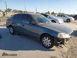 1999 Honda Civic DX with VIN 1HGEJ6629XL031952, listed as a Copart auction lot 41691105 with 66,909 mi miles and Salvage Title. Bid and sale history available at carsss.com. Image 4.