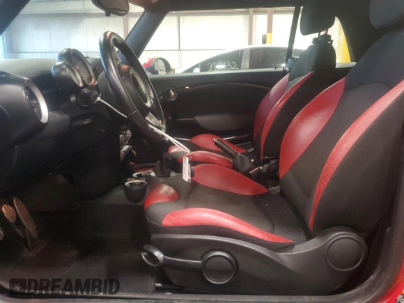2010 MINI Convertible S with VIN WMWMS3C50ATY51636, listed as a Copart auction lot 66097715 with 103,525 mi miles and Salvage title. Bid and sale history available at DreamBid. Image 7.