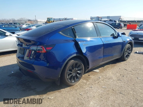 2021 Tesla Model Y Standard Range with VIN 5YJYGDED5MF121874, listed as a IAAI auction lot 41238170 with 72,041 mi miles and . Bid and sale history available at DreamBid. Image 4.