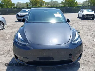 2024 Tesla Model Y with VIN 7SAYGDED3RF019063, listed as a IAAI auction lot 42061888 with 13,763 mi miles and . Bid and sale history available at DreamBid. Image 11.