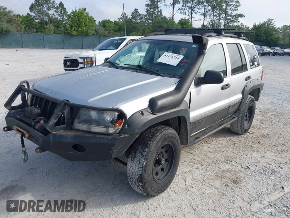 2003 Jeep Grand Cherokee Laredo z VIN 1J8GW48S33C519680, wystawiony jako IAAI lot #42126714 z przebiegiem 295 517 mil mil oraz . Historia ofert i sprzedaży dostępna na DreamBid. Obrazek 2.