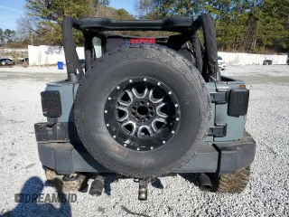 2014 Jeep Wrangler Sport z VIN 1C4AJWAG0EL119835, wystawiony jako Copart lot #88498755 z przebiegiem 151 756 mil mil oraz Szkoda całkowita • Salvage title. Historia ofert i sprzedaży dostępna na DreamBid. Obrazek 6.