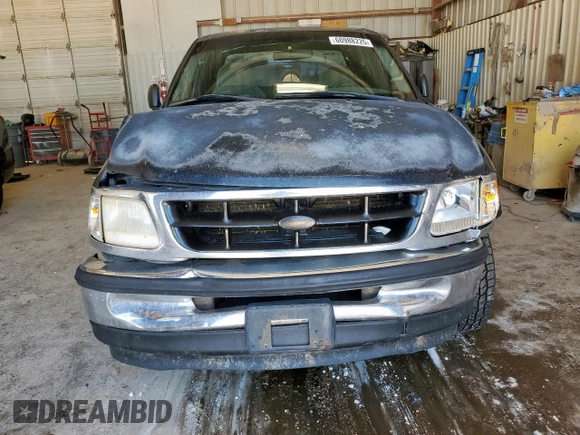 1998 Ford F-150 XL with VIN 1FTZX0725WKB83760, listed as a Copart auction lot 60988225 with 243,361 mi miles and Salvage title. Bid and sale history available at DreamBid. Image 5.