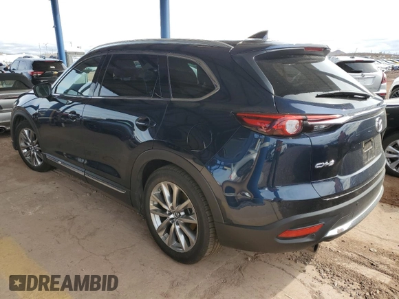 2018 Mazda CX-9 Grand Touring z VIN JM3TCADY2J0220873, wystawiony jako Copart lot #49264875 z przebiegiem Nie podano mil oraz Szkoda całkowita • Salvage title. Historia ofert i sprzedaży dostępna na DreamBid. Obrazek 2.