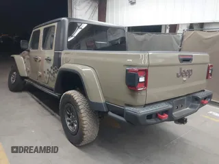 2020 Jeep Gladiator Rubicon z VIN 1C6JJTBGXLL178893, wystawiony jako IAAI lot #42206863 z przebiegiem 29 138 mil mil oraz . Historia ofert i sprzedaży dostępna na DreamBid. Obrazek 3.