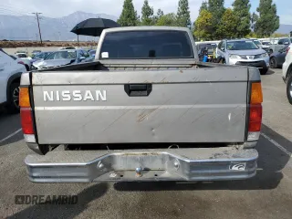 1987 Nissan Hardbody E z VIN JN6ND11SXHW014073, wystawiony jako Copart lot #78956934 z przebiegiem 381 885 mil mil oraz Szkody całkowita. Historia ofert i sprzedaży dostępna na DreamBid. Obrazek 6.