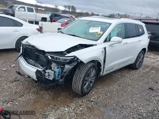 2021 Cadillac XT6 Premium Luxury with VIN 1GYKPFRS0MZ100879, listed as a IAAI auction lot 41083030 with 56,502 mi miles. Bid and sale history available at carsss.com. Image 2.