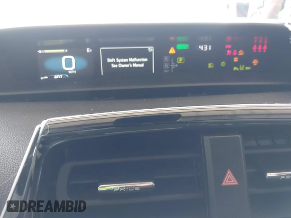 2021 Toyota Prius L Eco z VIN JTDKAMFU5M3146342, wystawiony jako IAAI lot #42249219 z przebiegiem 49 810 mil mil oraz . Historia ofert i sprzedaży dostępna na DreamBid. Obrazek 7.