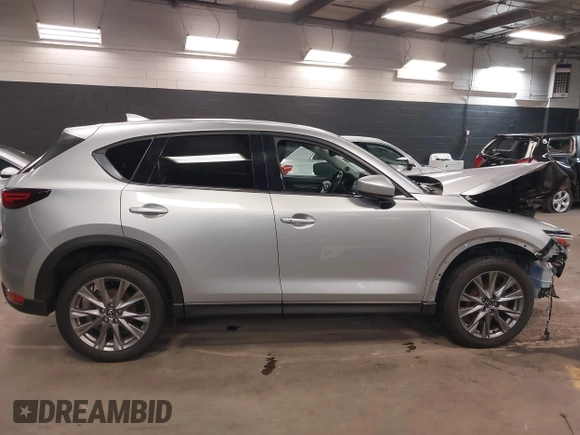 2021 Mazda CX-5 Grand Touring with VIN JM3KFBDM7M1392644, listed as a IAAI auction lot 41824612 with 80,000 mi miles and . Bid and sale history available at DreamBid. Image 12.