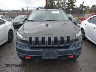 2015 Jeep Cherokee Trailhawk with VIN 1C4PJMBB5FW510514, listed as a IAAI auction lot 41492111 with 98,482 mi miles and . Bid and sale history available at DreamBid. Image 13.