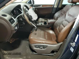 2014 Volkswagen Touareg Sport с VIN WVGEF9BP2ED002718, выставлен на аукционе Copart как лот 59526575 с пробегом 194 480 миль миль и На запчасти • Non repairable. История ставок и продаж доступна на DreamBid. Изображение 7.