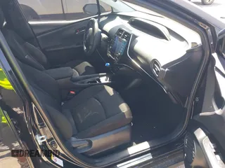 2021 Toyota Prius L Eco z VIN JTDKAMFU6M3141392, wystawiony jako IAAI lot #42317866 z przebiegiem 137 495 mil mil oraz . Historia ofert i sprzedaży dostępna na DreamBid. Obrazek 5.