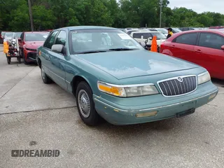 1997 Mercury Grand Marquis GS z VIN 2MELM74W8VX735986, wystawiony jako IAAI lot #42127919 z przebiegiem 135 895 mil mil oraz . Historia ofert i sprzedaży dostępna na DreamBid. Obrazek 1.