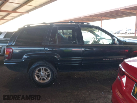 1999 Jeep Grand Cherokee Limited with VIN 1J4GW68N6XC675399, listed as a IAAI auction lot 41745815 with 217,800 mi miles. Bid and sale history available at carsss.com. Image 13.