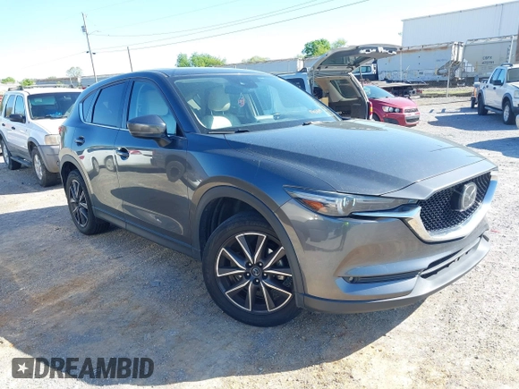 2018 Mazda CX-5 Grand Touring with VIN JM3KFBDM7J0454836, listed as a IAAI auction lot 42001397 with 146,879 mi miles. Bid and sale history available at carsss.com. Image 1.