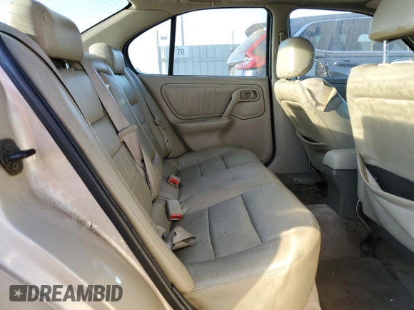 2001 Infiniti G20 Luxury z VIN JNKCP11A01T400404, wystawiony jako Copart lot #69899274 z przebiegiem 243 332 mil mil oraz Szkoda całkowita • Salvage title. Historia ofert i sprzedaży dostępna na DreamBid. Obrazek 10.