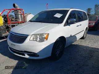 2014 Chrysler Town & Country Limited with VIN 2C4RC1GG8ER332790, listed as a IAAI auction lot 42050062 with 168,048 mi miles. Bid and sale history available at carsss.com. Image 2.