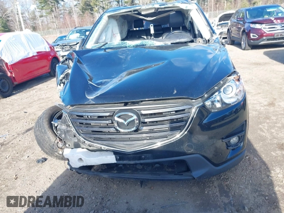 2016 Mazda CX-5 Grand Touring with VIN JM3KE4DY4G0909782, listed as a IAAI auction lot 41006111 with 30,135 mi miles. Bid and sale history available at carsss.com. Image 11.