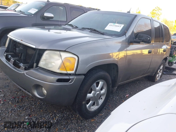 2005 GMC Envoy SLE with VIN 1GKDS13S352215032, listed as a IAAI auction lot 41221612 with 260,647 mi miles and . Bid and sale history available at DreamBid. Image 2.