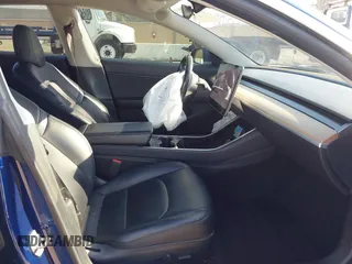 2018 Tesla Model 3 Long Range Battery with VIN 5YJ3E1EA4JF011799, listed as a IAAI auction lot 41765860 with 133,098 mi miles. Bid and sale history available at carsss.com. Image 5.