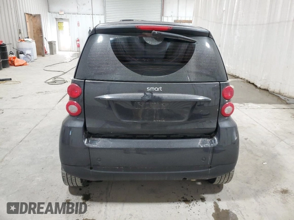2011 Smart fortwo Pure с VIN WMEEJ3BA5BK480412, выставлен на аукционе Copart как лот 87023194 с пробегом 70 496 миль миль и Списание • Salvage title. История ставок и продаж доступна на DreamBid. Изображение 6.